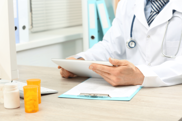 clinician reviewing serious adverse event on iPad