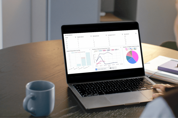 Person using TrialKit on a laptop for AI advanced analytics