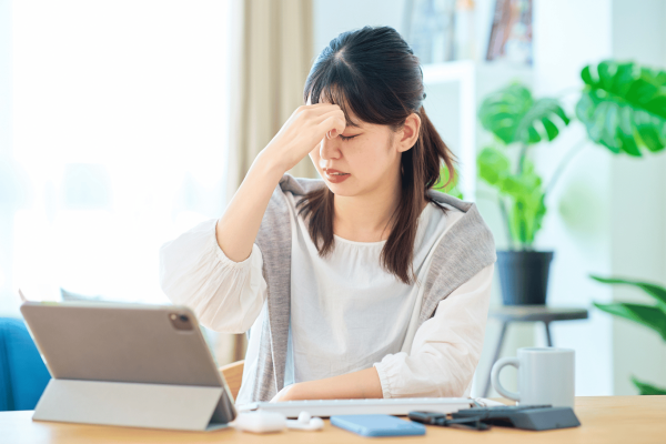 woman using iPad in a home setting
