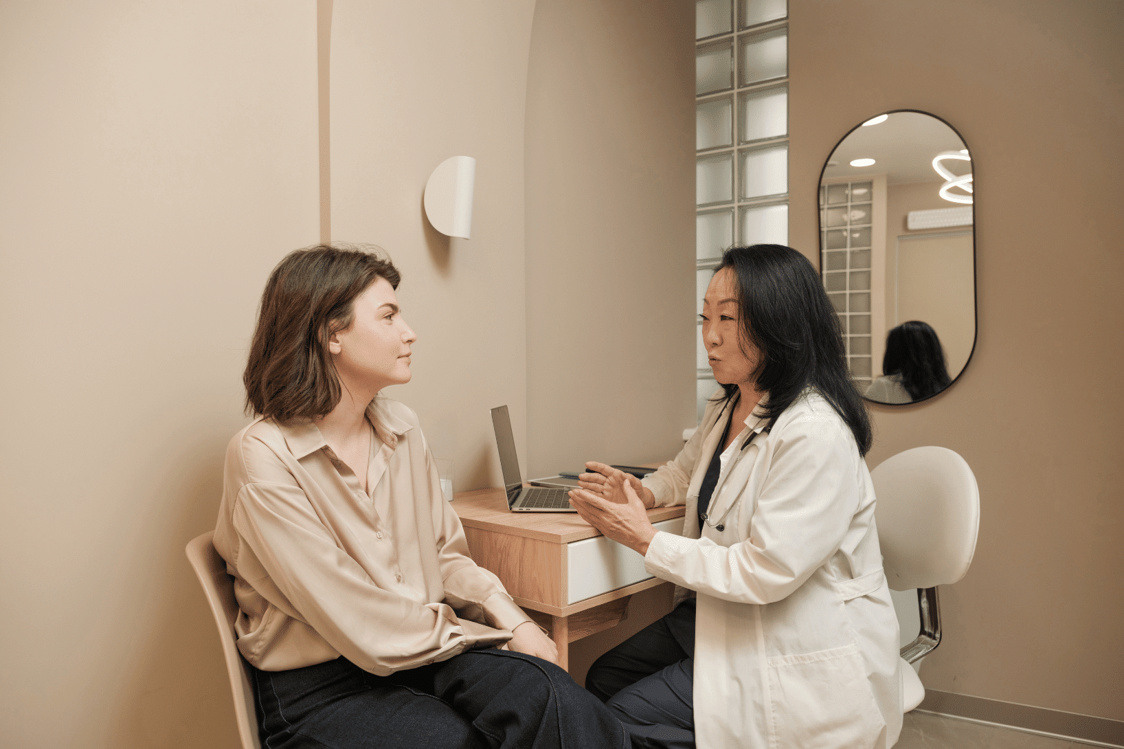 clinician reviewing informed consent on laptop with study participant
